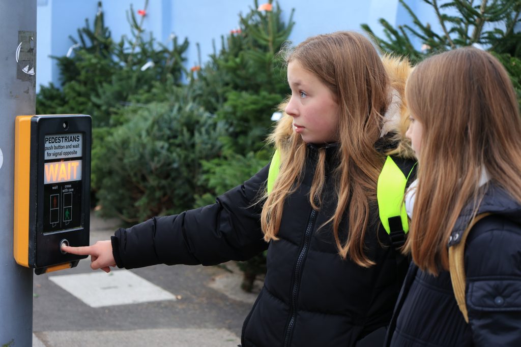 Children waiting to cross the road